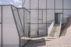 Woman next to contemporary building