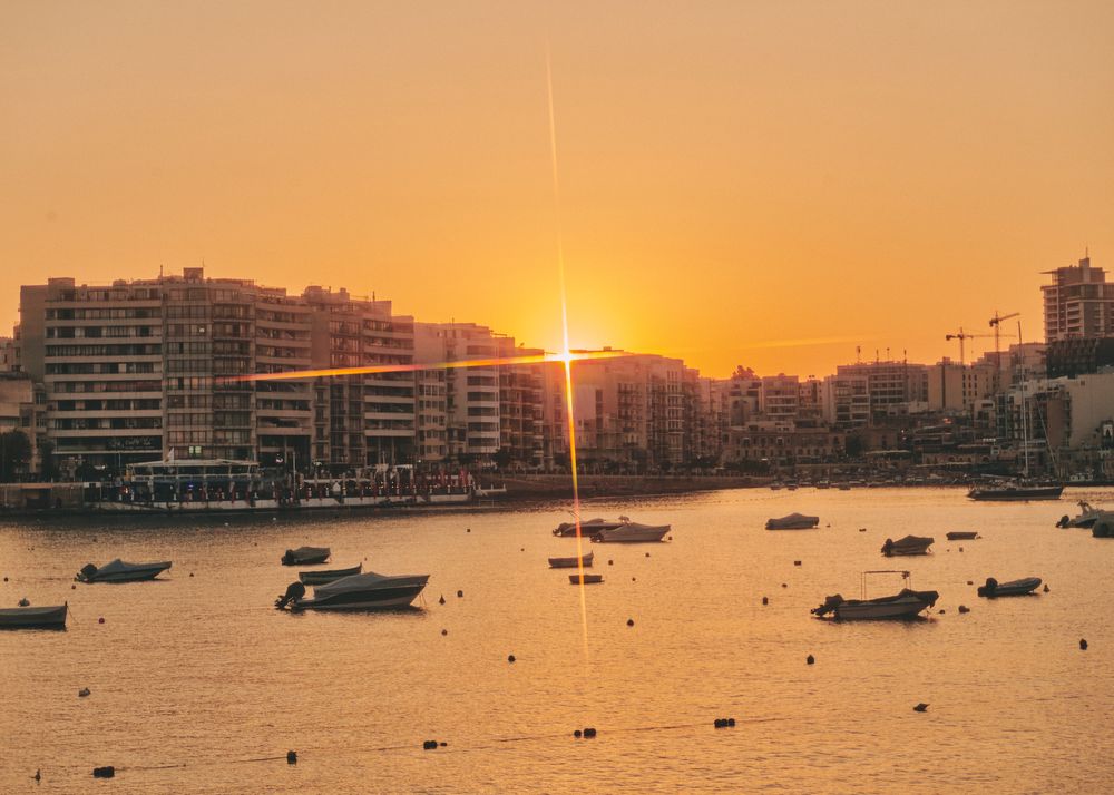Yachts anchored in the Mediterranean Sea during colorful sunset