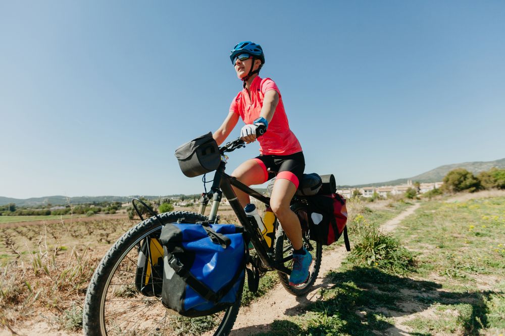 Woman riding bicycle in forest