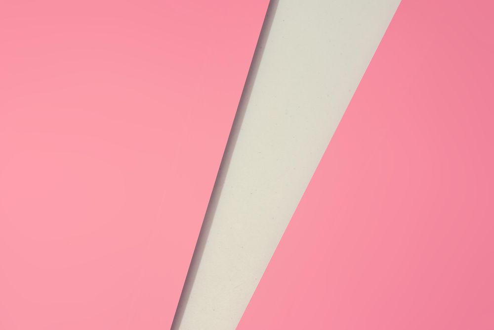 Pink paper with light geometric cut out