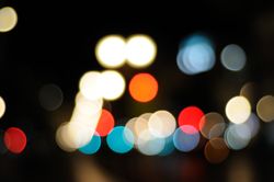 Unfocused night lights along city street