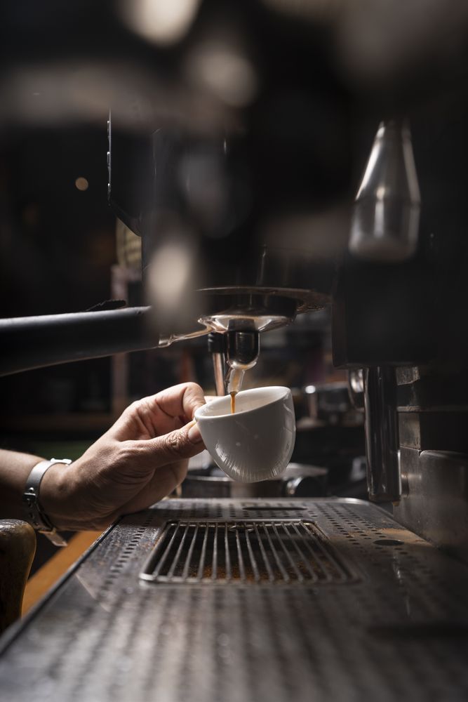 Barista using coffee machine