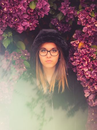 Woman on background of stunning violet flowers