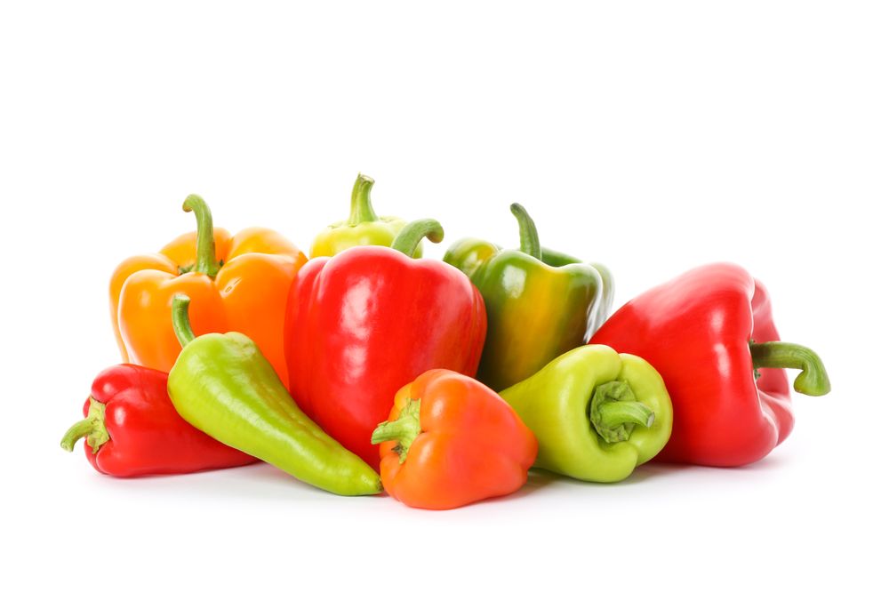 Different tasty peppers isolated on plain background
