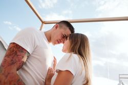 Passionate couple kissing in a transparent bubble room