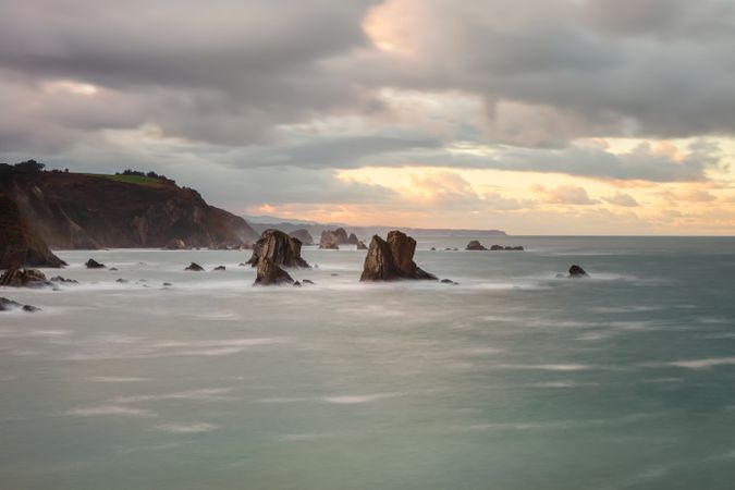 Storm with blustering waves on rocky coast