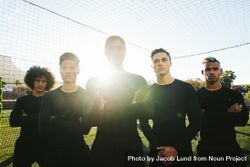 Determined young soccer players standing on a field in bright sun 4jpRz0