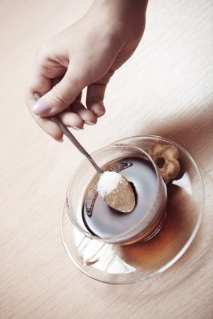 Human hands making tea