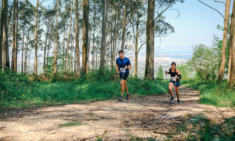 Young woman and man doing trail