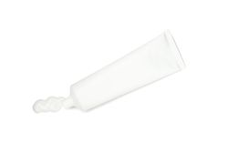 Blank tube with toothpaste isolated on light background