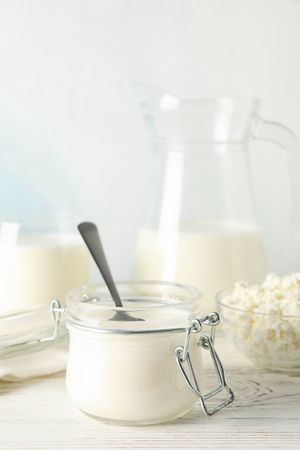 Different dairy products on wooden background, copy space