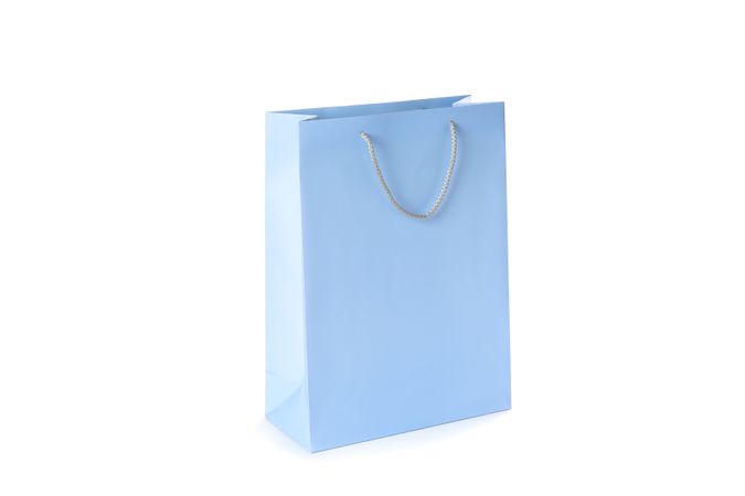 Blue paper bag isolated on blank background