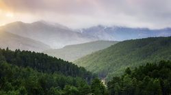 Sunset over hilly terrain