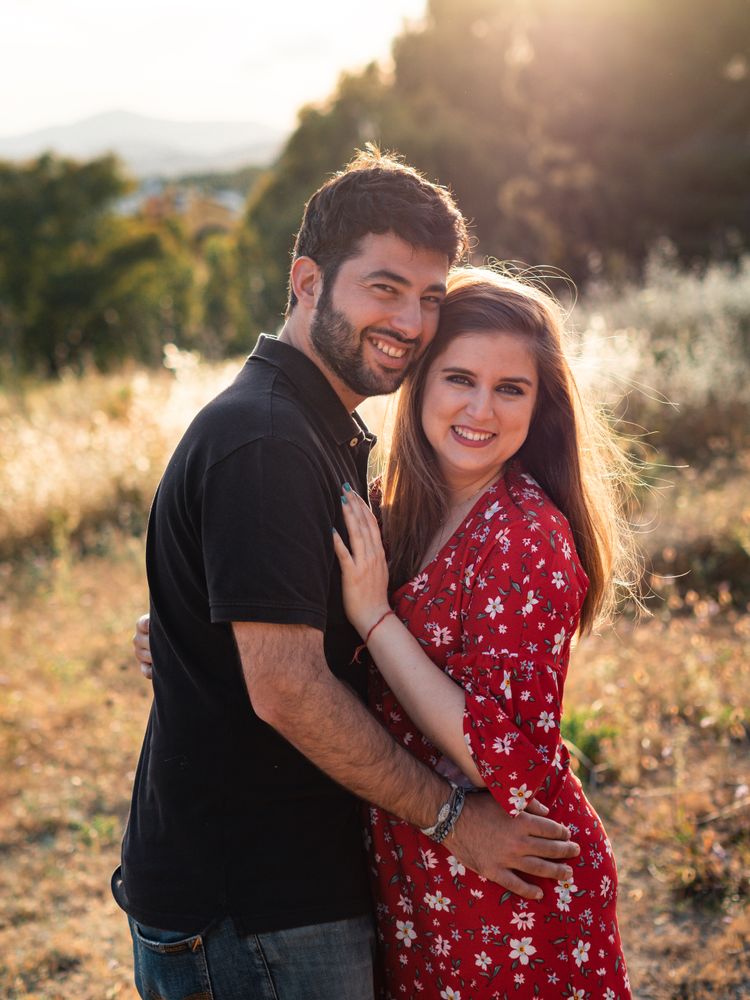 Young happy couple embracing in beautiful garden