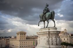 Soldiers guarding ancient monument on cloudy day