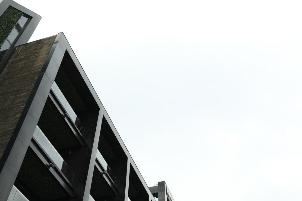 Hotel on light background, space for text