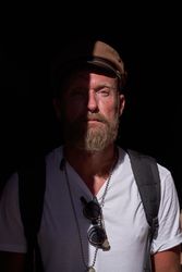 Confident bearded man in trendy clothes