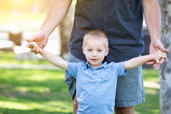 Father and Son Having Fun At The Park