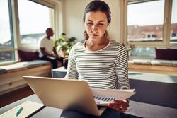 Pensive businesswoman on her laptop