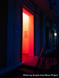 Open door of red lit room at night 4dgGD5