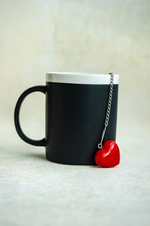 St. Valentine's Day card with mug with heart on chain