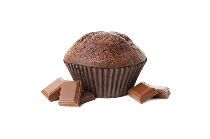 Delicious chocolate and muffin isolated on studio background