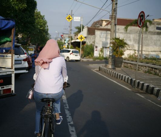 Woman on bike on Indonesia street