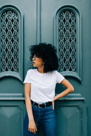 Stylish Black female by green door