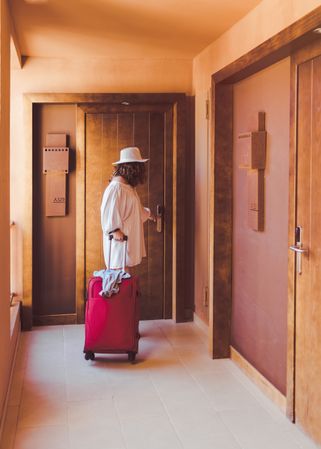 Woman closing hotel door