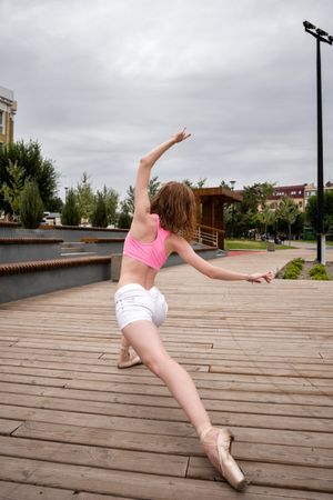 Unrecognizable ballet dancer in city street