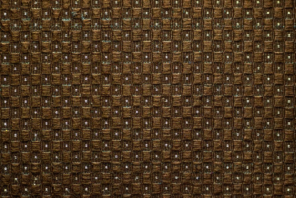 Texture background of brown cloth sofa in a pattern