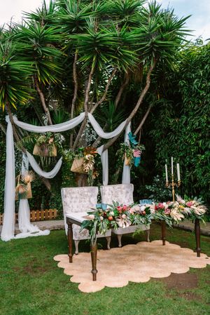 Newlyweds table setting in tropical garden