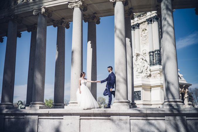 Newlyweds near columns