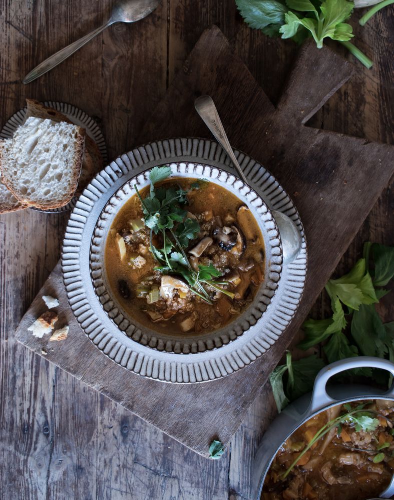 Bread and parsley near quinoa soup