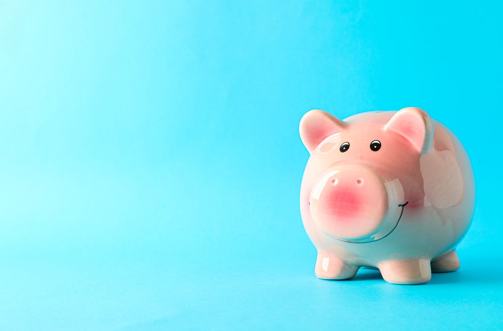 Happy piggy bank on color background, space for text. Finance, saving money