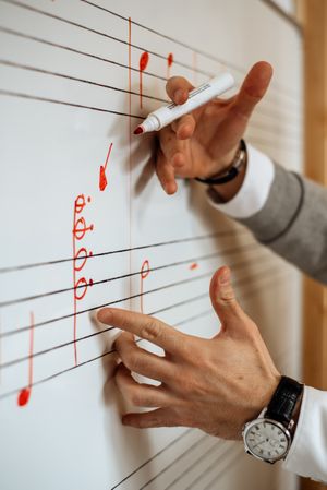 Man writing music notes