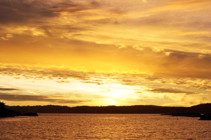 Vibrant golden sunset above seaside