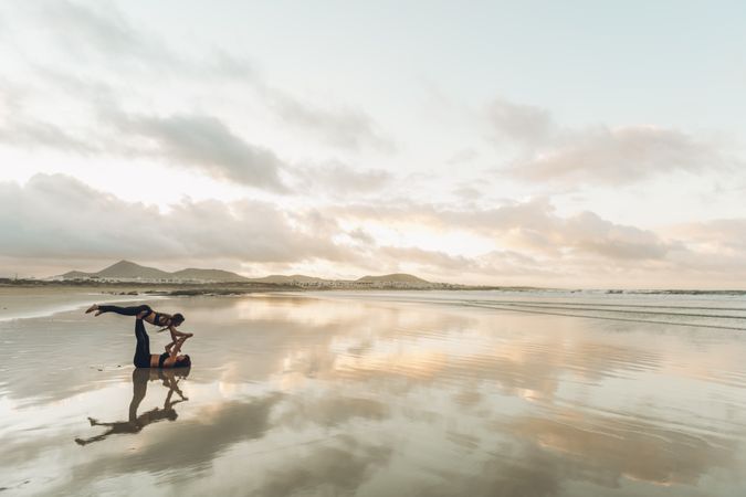 Women exercising near sea