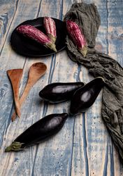 Ripe eggplants on tabletop