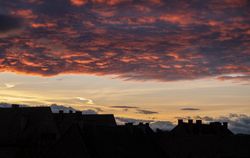 Pink clouds over the last light in the sky before sunset