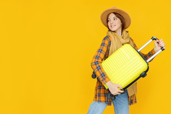 Concept of people, young woman on yellow background, space for text