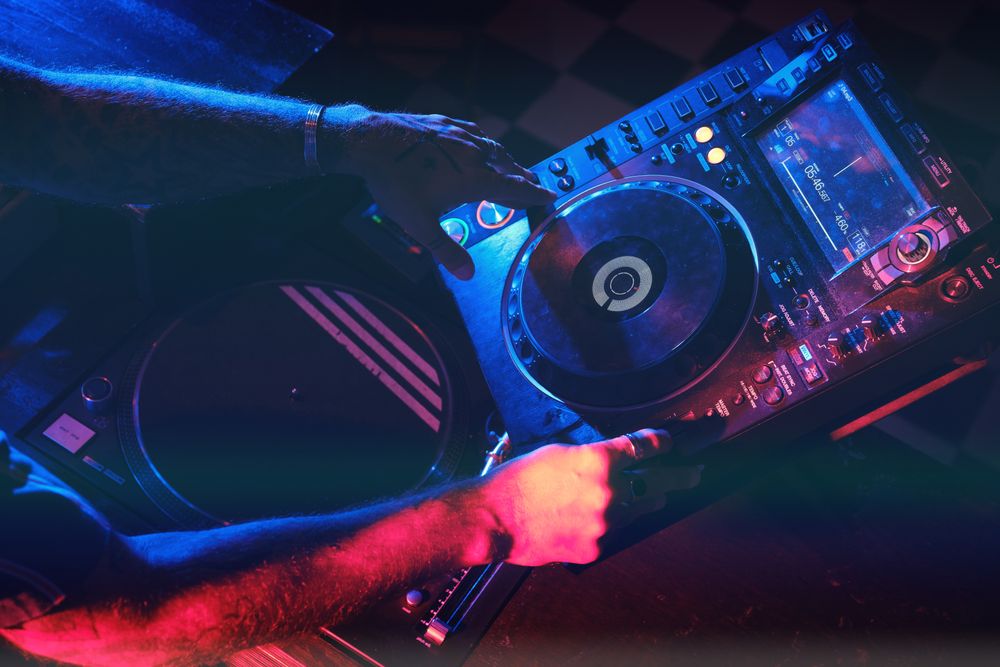 Anonymous DJ playing song on CDJ player