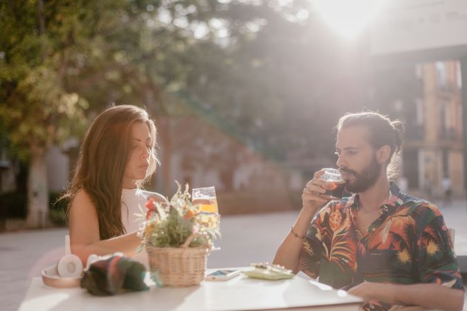 Loving couple clinking glasses on cafe terrace