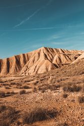 Desert cliffs under blue sky in landscape
