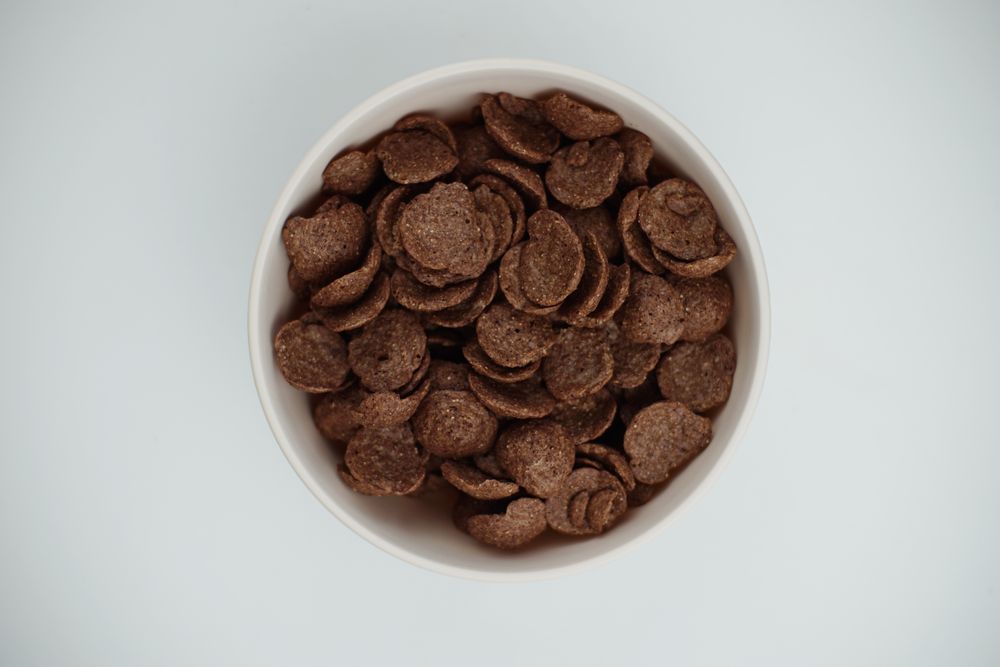 A bowl of chocolate flakes on a table