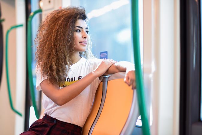 Arab woman sitting in subway carriage
