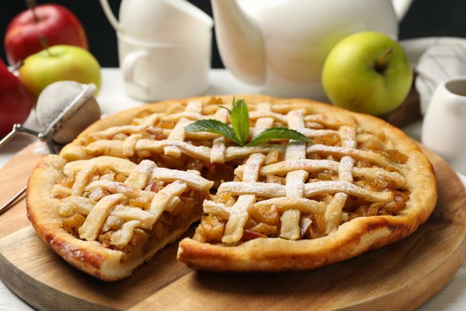 Tasty apple pie on wooden background, close up. Homemade food