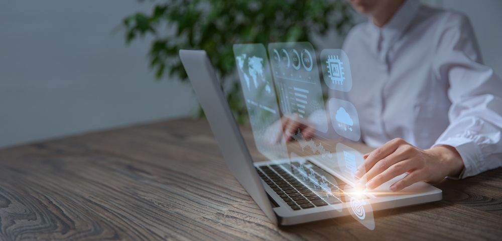 Businesswoman analyzing and calculating financial data on laptop