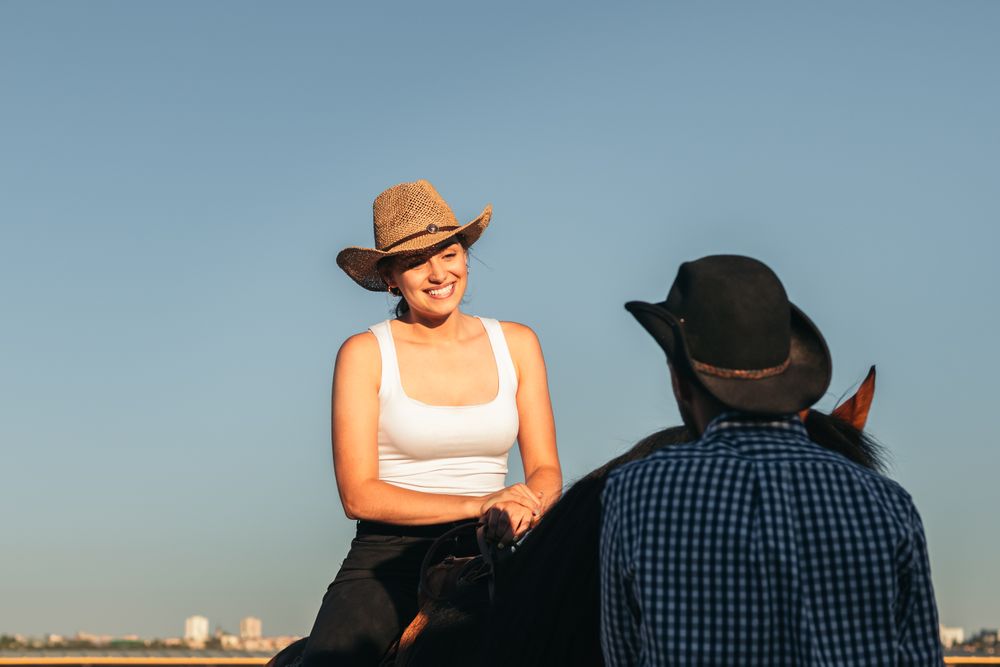 Woman riding a horse in an equestrian center