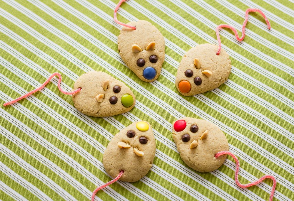 Cookies with mouse shaped and red licorice tail